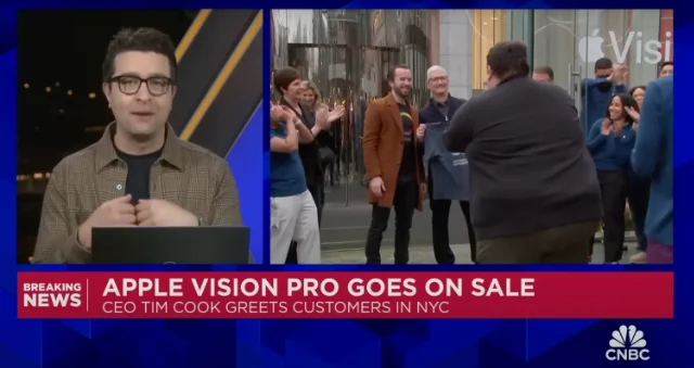 CNBC broadcast still showing the t-shirt handover