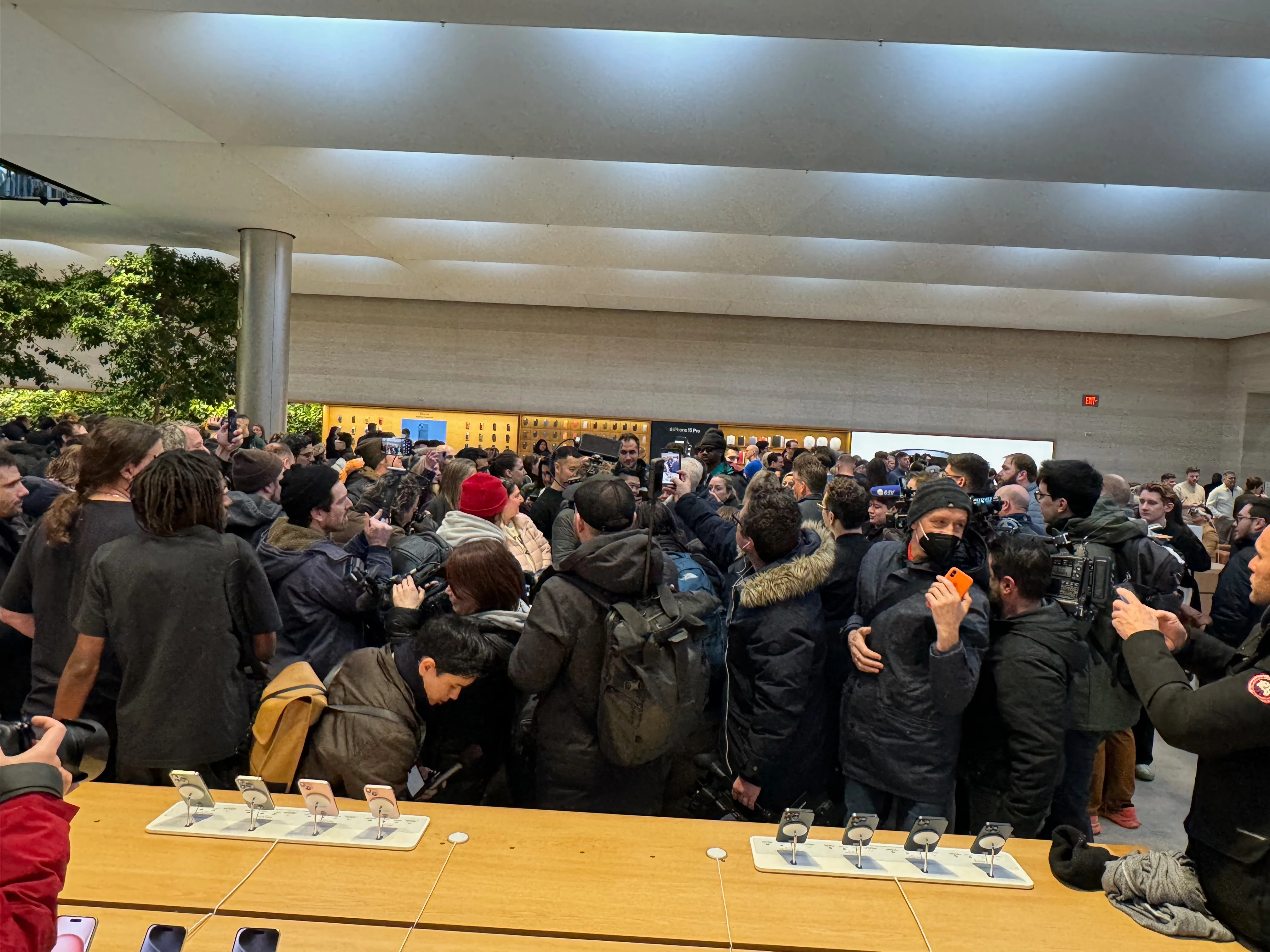 The crowd surrounding Tim Cook inside the store